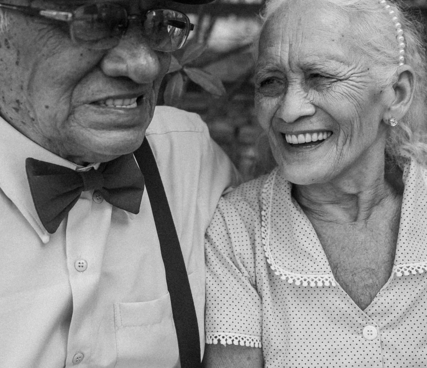 An older couple laughing together